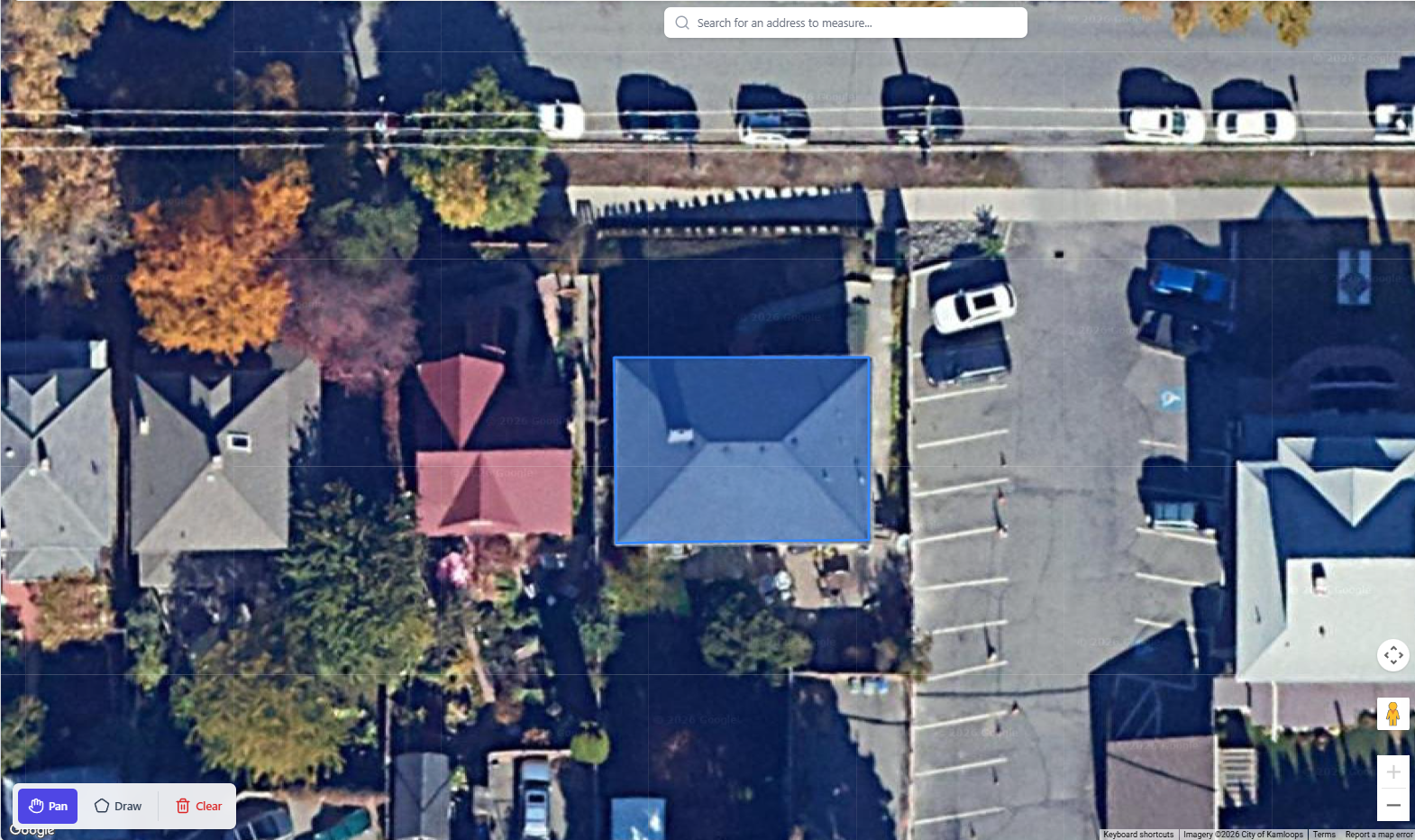 Satellite roof measurement tool showing aerial view of a property with roof sections outlined